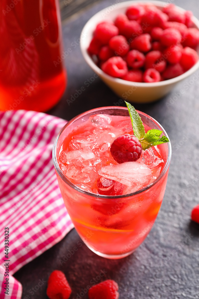 Glass of tasty raspberry lemonade on dark table Glass of tasty raspberry lemonade on dark table