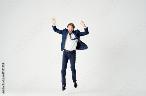 business man in a suit emotions jumping full height Victory