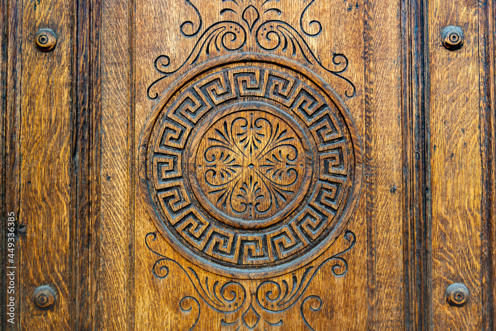 beautiful carving on the front door made of solid wood