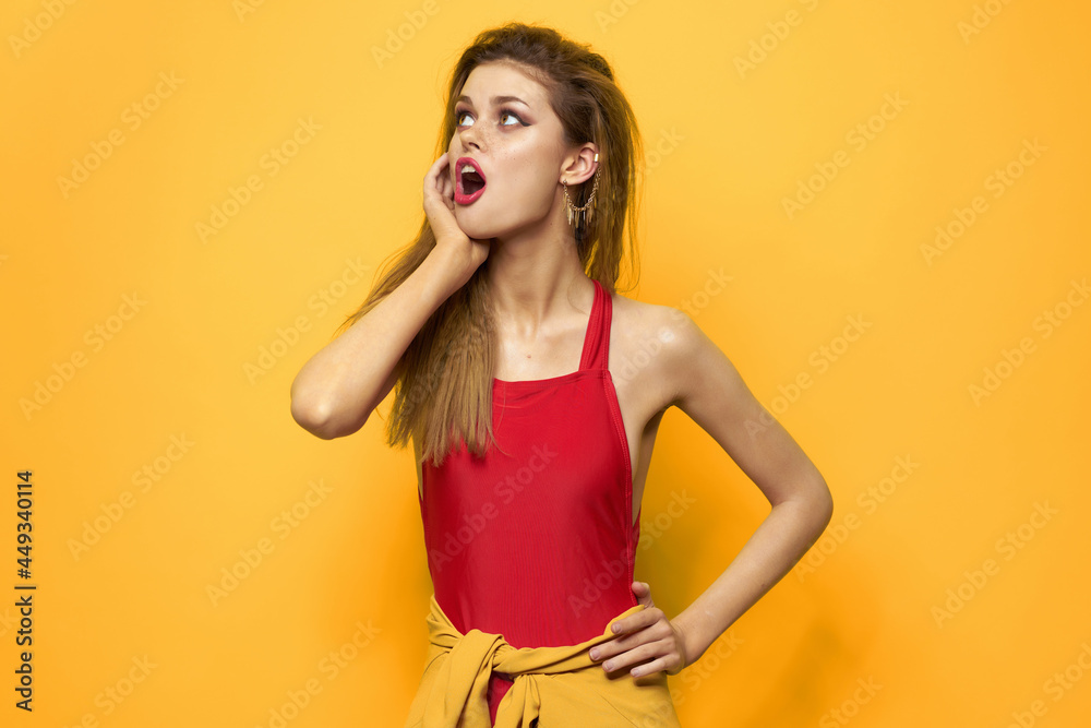 pretty woman in red t-shirt cosmetics decoration fashion yellow background pretty woman in red t-shirt cosmetics decoration fashion yellow background