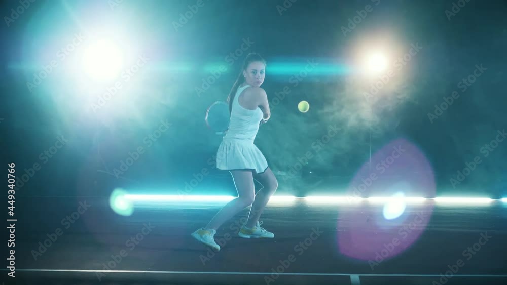 Slow motion of an athlete successfully hitting a tennis ball Slow motion of an athlete successfully hitting a tennis ball