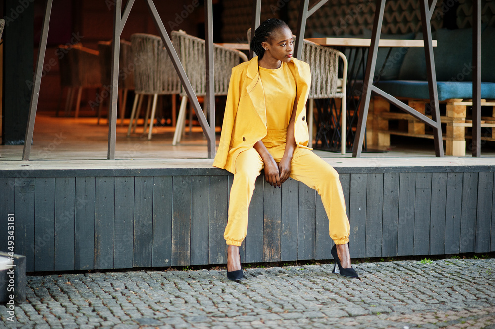 Portrait of nice-looking fashionable attractive lovely content cheerful cheery african american girl wear bright vivid shine vibrant yellow color jacket or costume. Portrait of nice-looking fashionable attractive lovely content cheerful cheery african american girl wear bright vivid shine vibrant yellow color jacket or costume.
