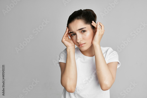 upset woman holding her head pain discontent depression