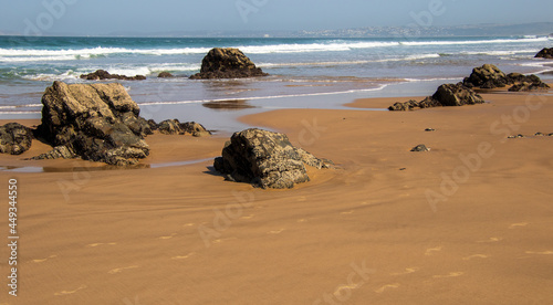 Beach sand and rock formations on Keurboomsriver Beach on the Garden Route in South Africa photo