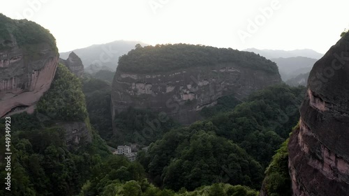 Aerial: Bajiaozhai shan mountain in Ziyuan, Hunan, China at sunset photo