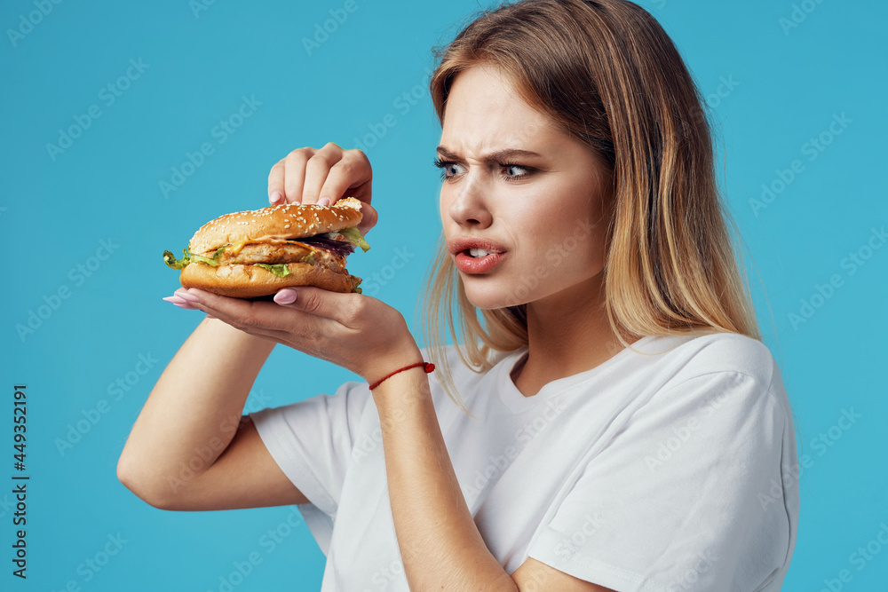 blonde in white t-shirt hamburger fast food snack joy blonde in white t-shirt hamburger fast food snack joy