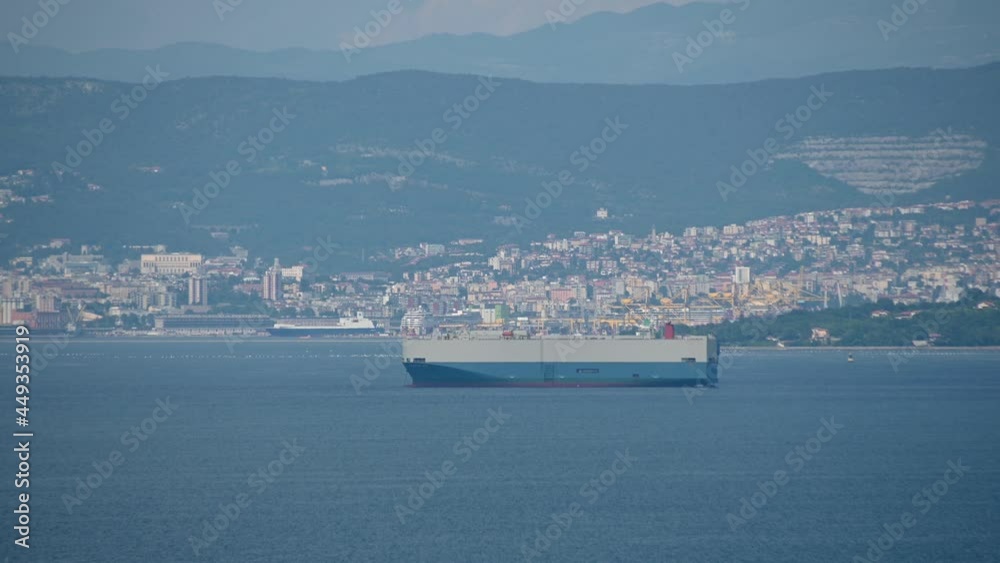 Establishment shot of Italian coast in the distance. Elevated view of Gulf of Trieste. Big ship anchored in Adriatic Sea. Static shot, real time Establishment shot of Italian coast in the distance. Elevated view of Gulf of Trieste. Big ship anchored in Adriatic Sea. Static shot, real time