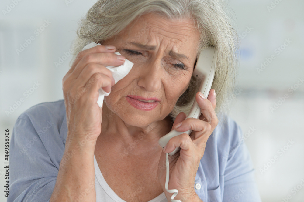 sad senior woman talking on phone sad senior woman talking on phone
