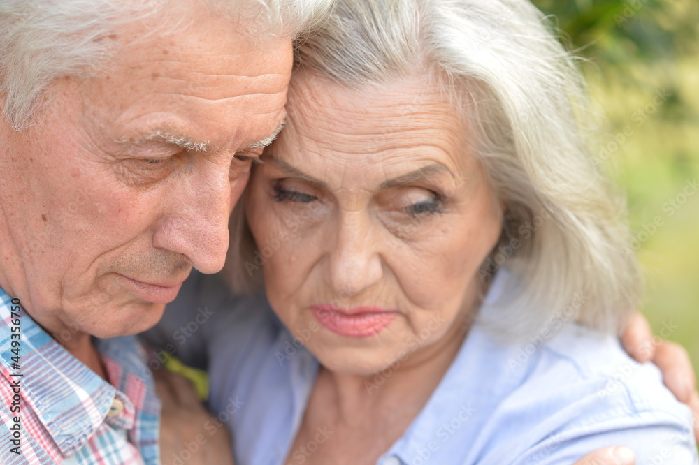 Portrait of sad senior couple in the park Portrait of sad senior couple in the park