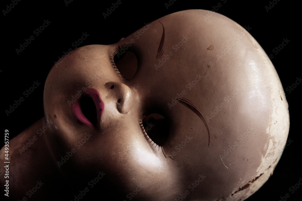 Disturbing image of an old doll's head Disturbing image of an old doll's head