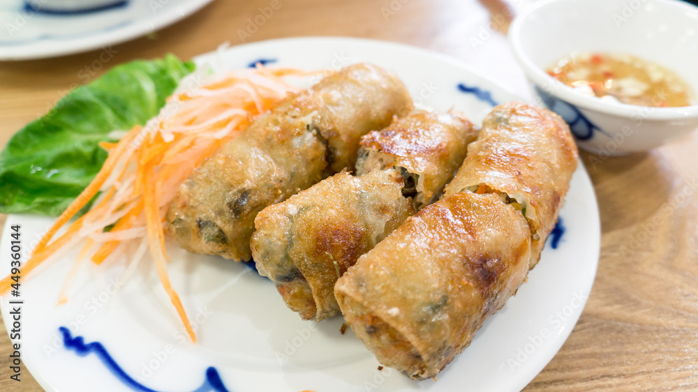 Vietnamese fried spring rolls Cha Gio with fish dipping sauce.