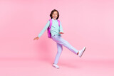 Photo of glad nice carefree schoolboy party dance wear bag specs teal shirt isolated pink color background