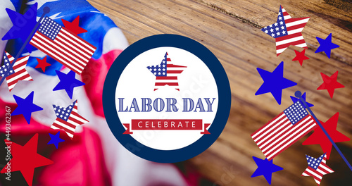 Image of happy labour day text with american flags, star and flag elements, over wood