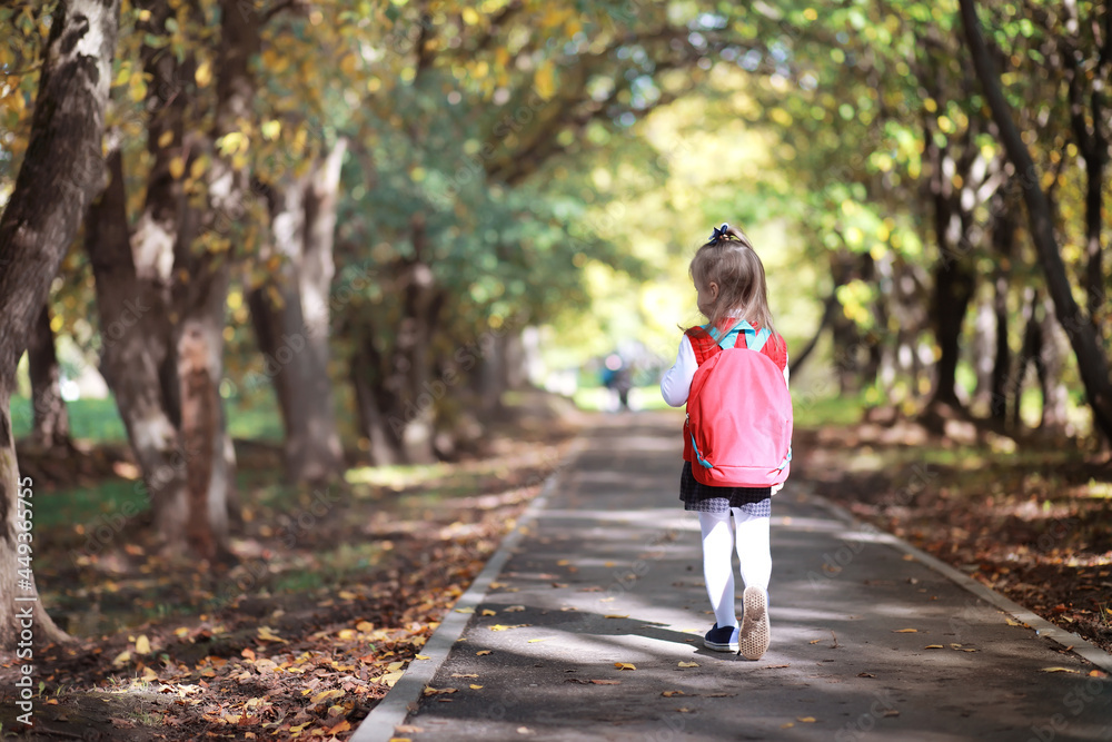 Children with briefcases for a walk in the park. School break. The beginning of the children's studies. Children with briefcases for a walk in the park. School break. The beginning of the children's studies.