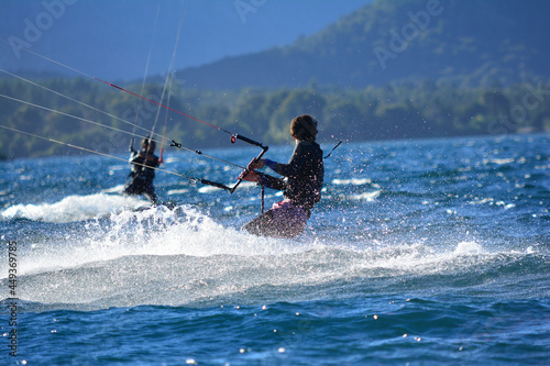 two young men doing kitsurf in a lake in Patagonia Argentina © Lautaro