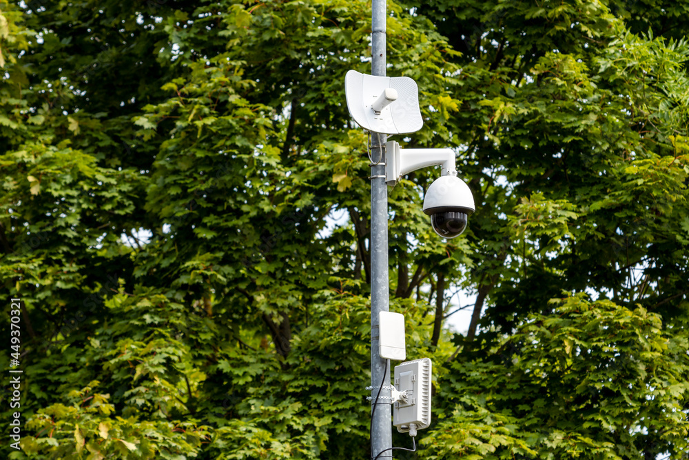 CCTV camera on metal pole in public park CCTV camera on metal pole in public park