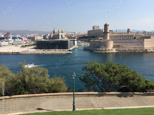 Panoramic view of Fort Saint-Jean on the right and Marseille Cathedral and Mucem museum on the left, seen from the Pharo Palace in Marseille, France.