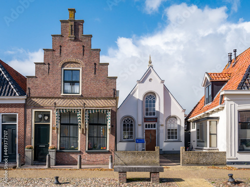 Obraz na płótnie Bethel church and house with stepped gable in old town of Workum, Friesland, Net