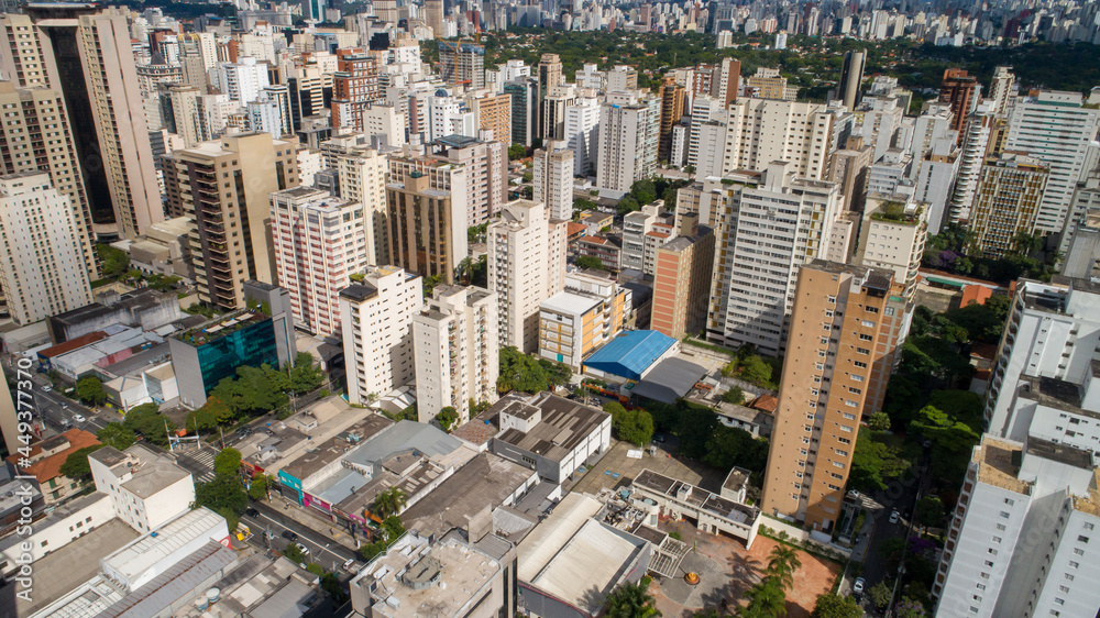 Fototapeta premium Aerial view of Sao Paulo city. Prevervetion area with trees and green area of Ibirapuera park in Sao Paulo city, Brazil