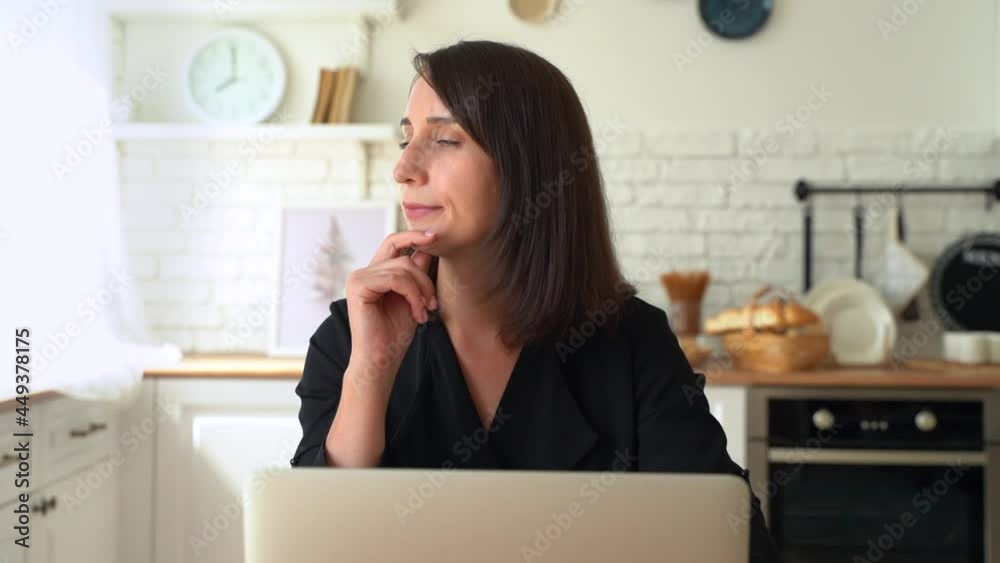 closeup view thoughtful concerned businesswoman working on laptop computer closeup view thoughtful concerned businesswoman working on laptop computer