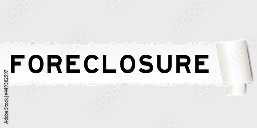 Ripped gray paper that have word foreclosure under torned part