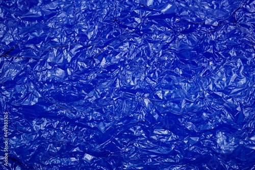 Billede på lærred Crumpled cellophane bright blue transparent plastic paper texture abstract background