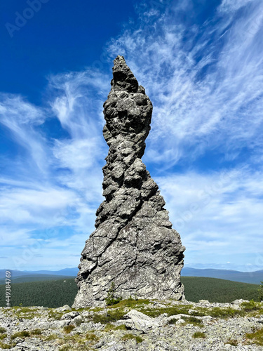 Stone pillars of weathering on the Manpupuner mountain plateau in the Komi Republic in Russia in summer. Rock Queen