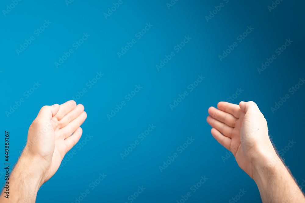 male shows outstretched hand with open palm male shows outstretched hand with open palm