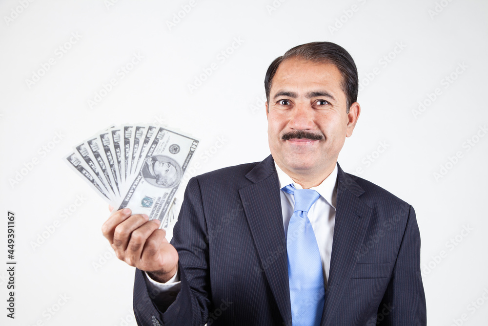 Mature company business man holding money showing prize winner in hand Mature company business man holding money showing prize winner in hand