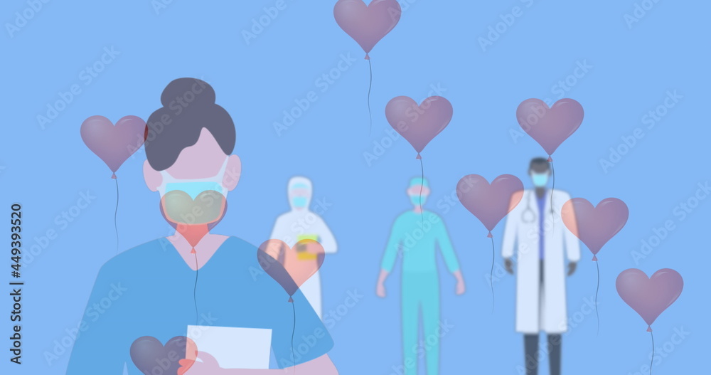 Multiple heart shaped balloons floating against health workers wearing face masks