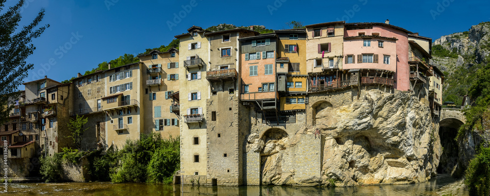 rural landscape with a view on the town of pont en royans and her houses on the cliff
