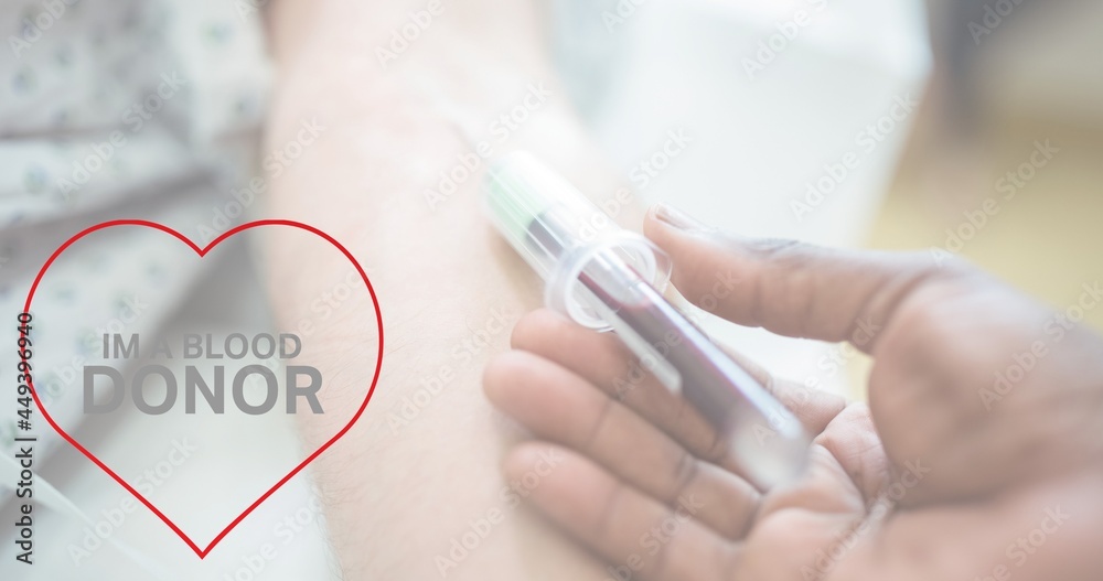 Composition of donate blood text over doctor drawing blood Composition of donate blood text over doctor drawing blood