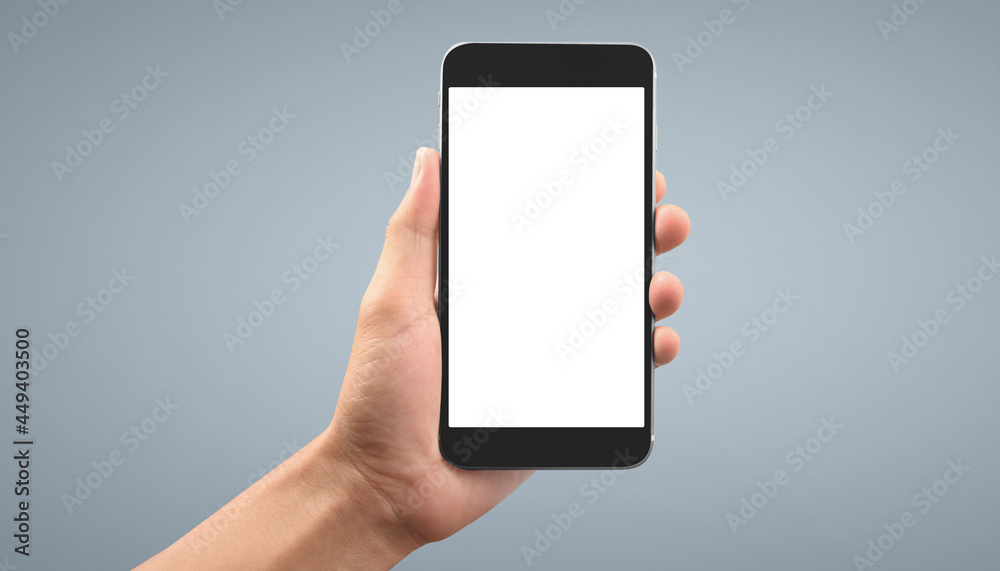 Hand holding smartphone device Hand holding smartphone device