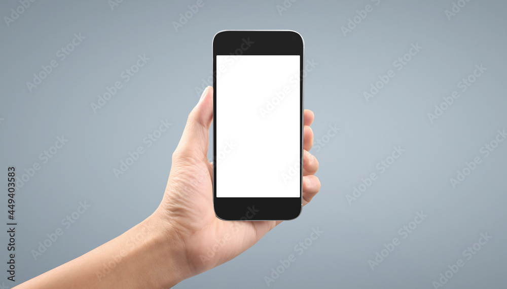 Hand holding smartphone device Hand holding smartphone device