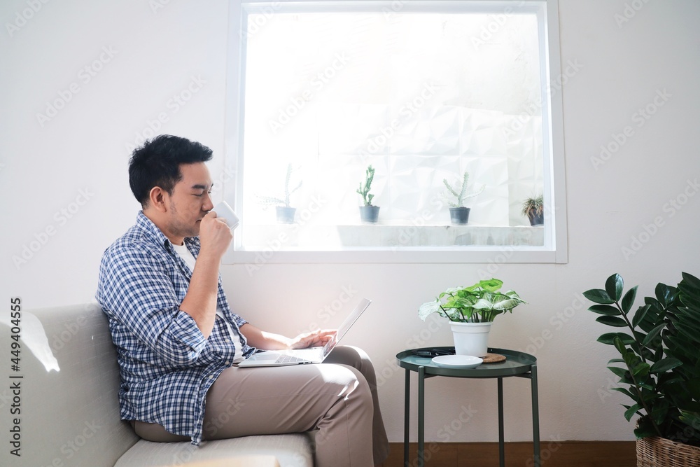 person sitting on sofa person sitting on sofa