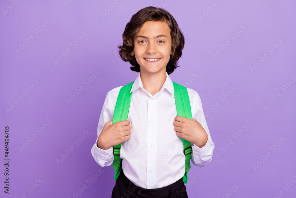Photo of sweet little brunet hair boy wear formalwear bag isolated on purple color background Photo of sweet little brunet hair boy wear formalwear bag isolated on purple color background