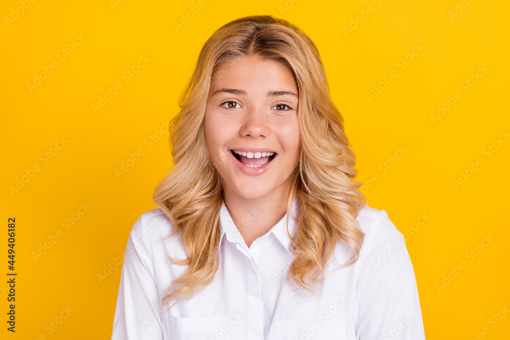Photo of excited amazed schoolgirl open mouth look camera wear white shirt isolated yellow color background Photo of excited amazed schoolgirl open mouth look camera wear white shirt isolated yellow color background