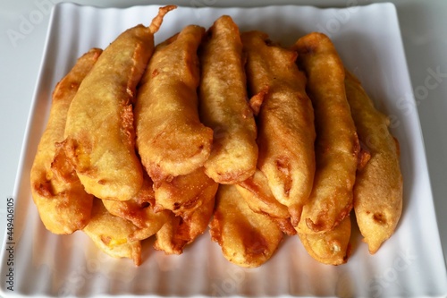 Pazhampori, a traditional Kerala tea time snack made of maida and sliced ripe banana, selective focus photo