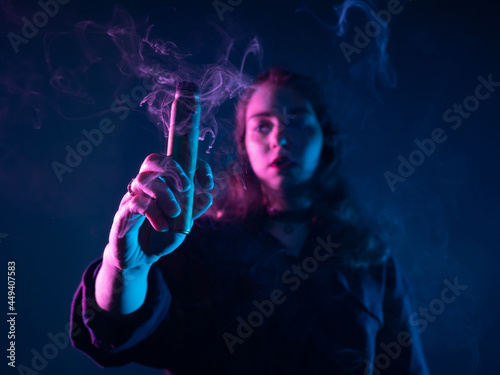 Vape girl holds the e-cig t...