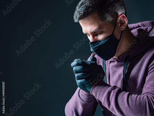 Praying in a medical mask. ...