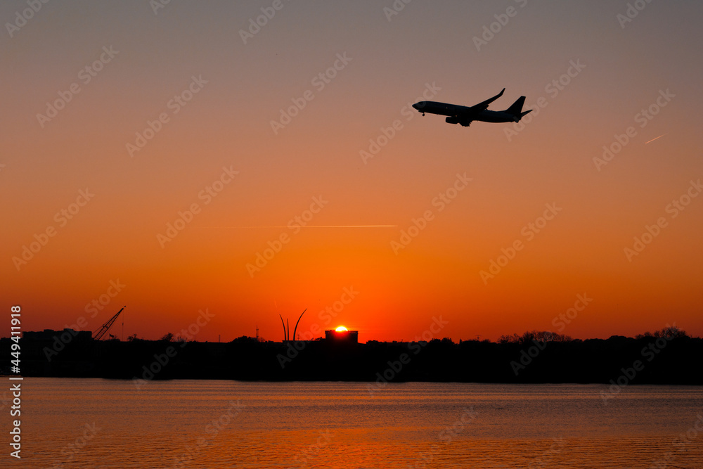Jet at sunset over the Tidal Basin, Washington, DC