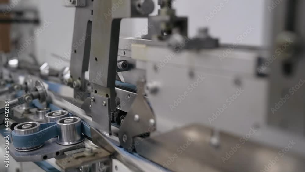 filling and packaging tape in the printing house finished products move along the conveyor. High quality FullHD footage filling and packaging tape in the printing house finished products move along the conveyor. High quality FullHD footage