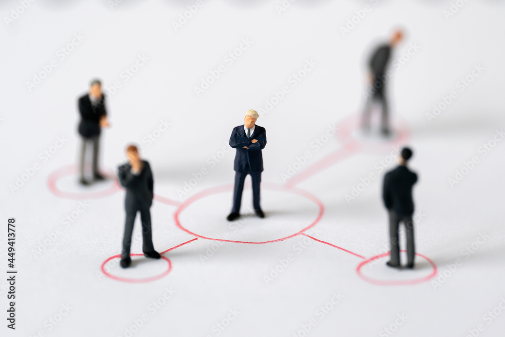 Miniature people Group of Businessman mini figures standing thinking on Graphic Info white background using as Success Business partnership development and Commerce Strategy winning Planning concepts Miniature people Group of Businessman mini figures standing thinking on Graphic Info white background using as Success Business partnership development and Commerce Strategy winning Planning concepts