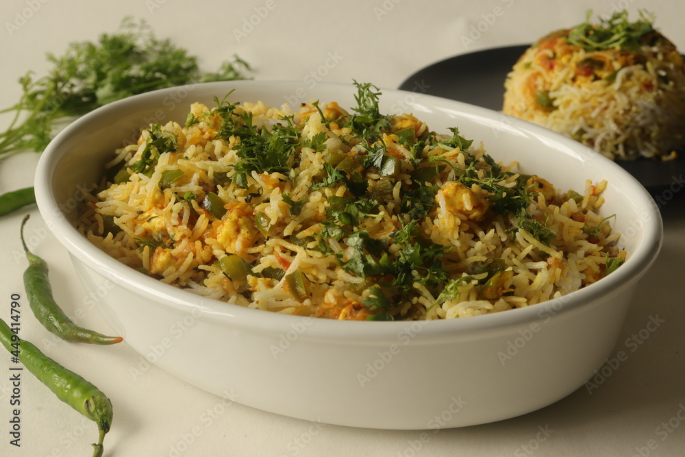 Steamed basmati rice tossed with a semi dry gravy of cottage cheese and bell peppers. Commonly known as Paneer rice in India.