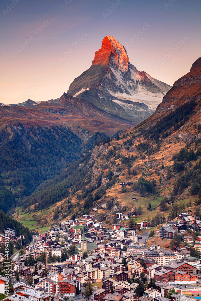 Zermatt, Switzerland. Image of iconic village of Zermatt, Switzerland with the Matterhorn in the background at beautiful sunny autumn sunrise.