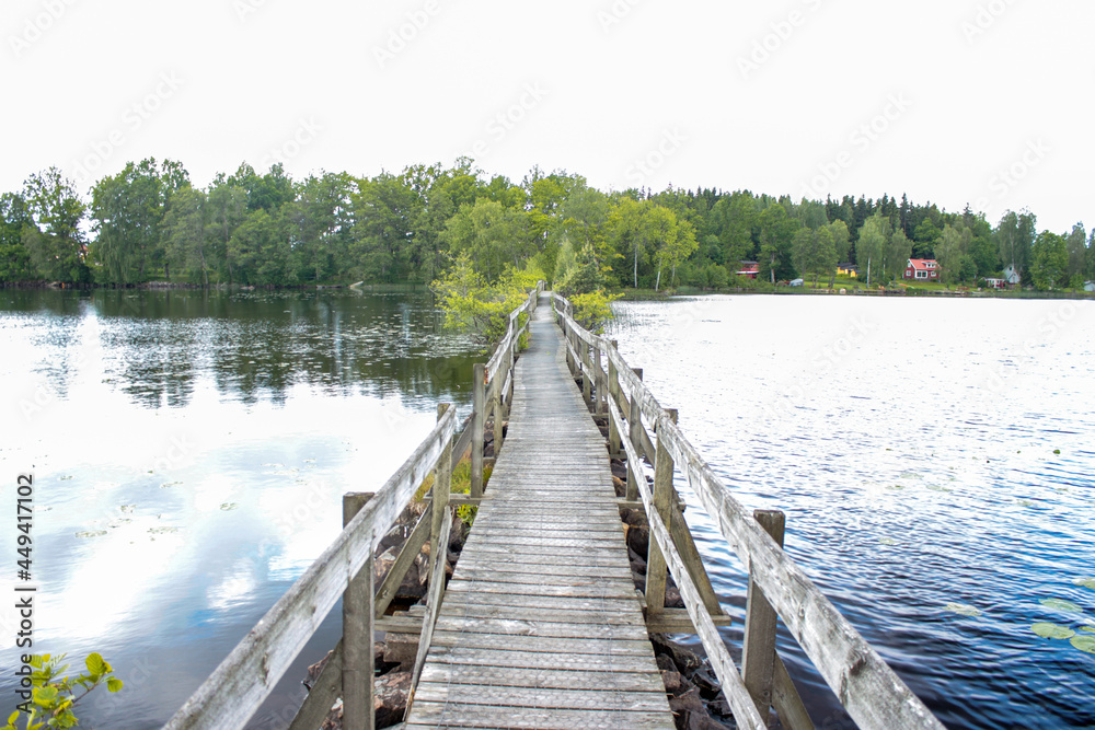 A small bridge over the Herrestad`s lake in Värnamo, Sweden