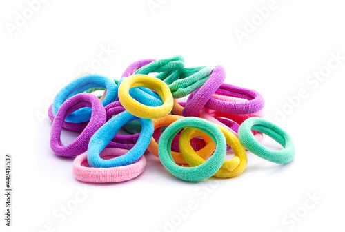 Heap of various hair ties. Multicolored elastics isolated on white background.