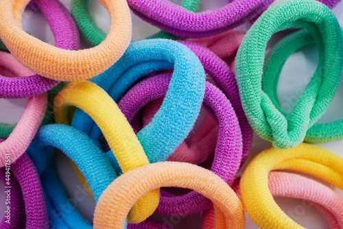 Closeup of various hair ties. Macro of multicolored elastics.
