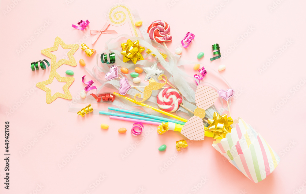Sweets, sweets, holiday accessories fly out of a paper cup