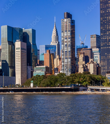 Manhattan skyline seen from Roosevelt Island with Empire State Building. New York  USA